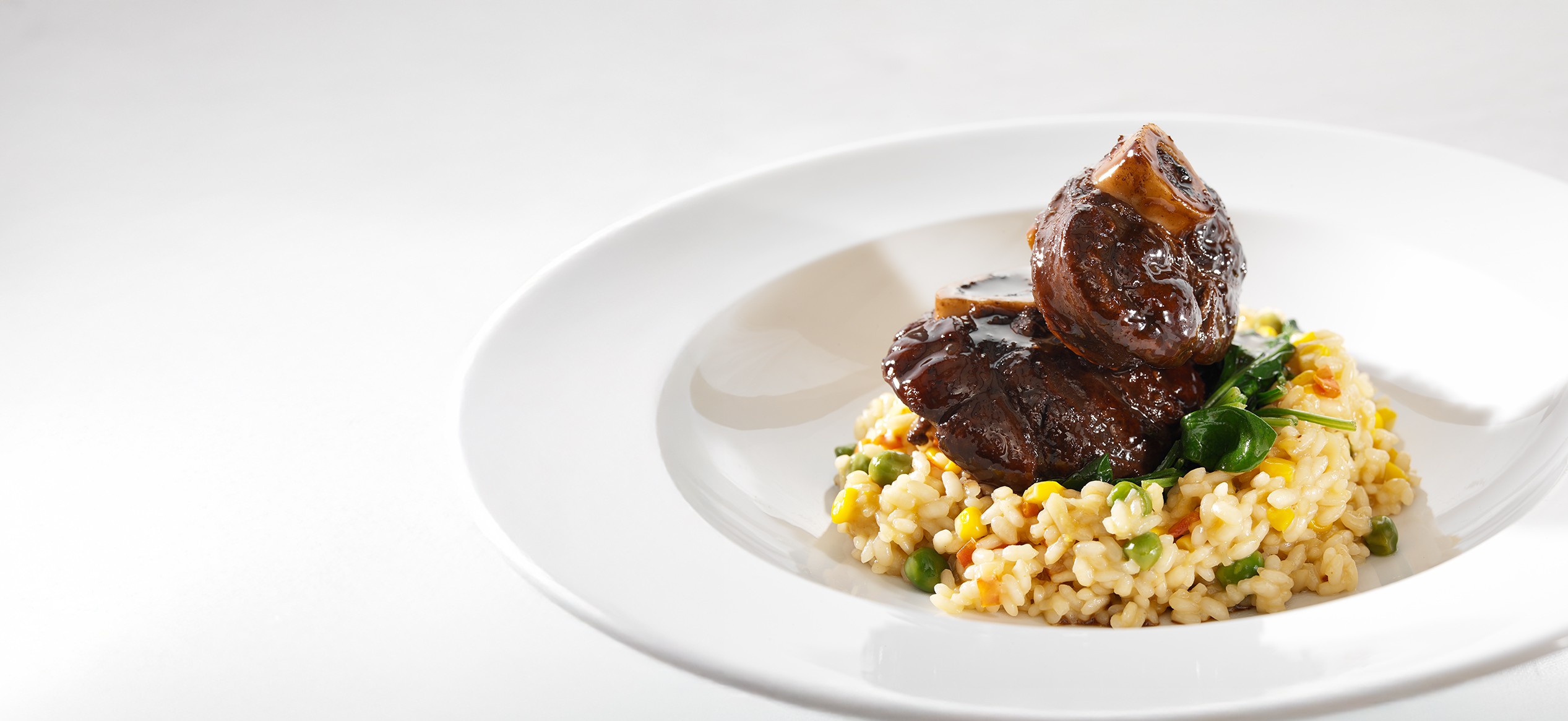 Osso Bucco new pea and sweetcorn risotto with red wine sauce Graham Brown b